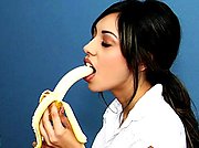 sexy brunette girl seduces her teacher by eating banana before getting fucked.