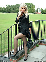 Office girl in heels and black pantyhose at the lunch walk