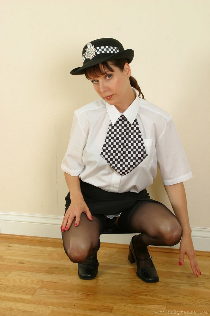 Sensual policewoman in nylons and heels